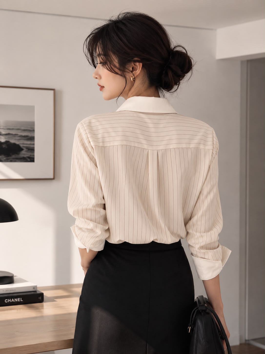 Ivory Pinstripe — back view of the Striped Oversized Shirt worn with a black pencil skirt