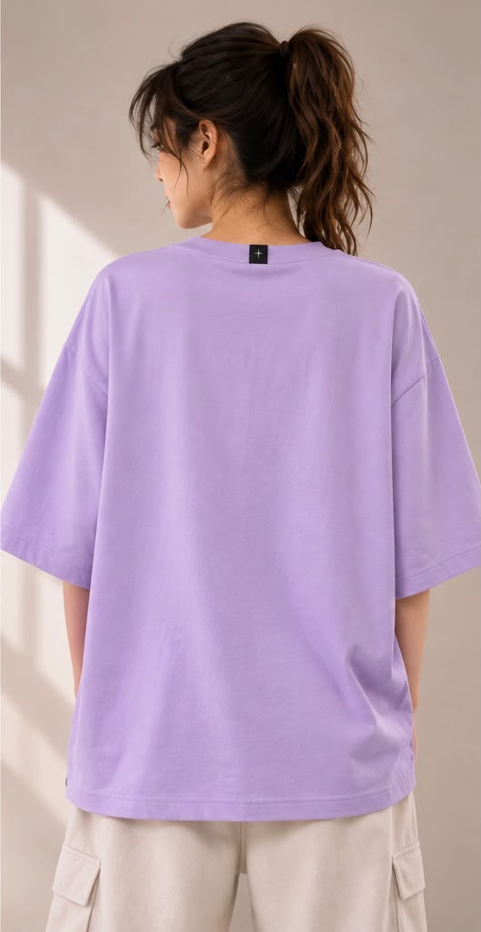 Wisteria — back view of the Abstract Saint oversized tee, showing the plain reverse and drop shoulders